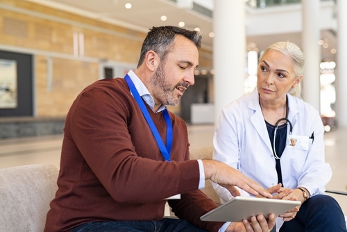 representative talking to female physician